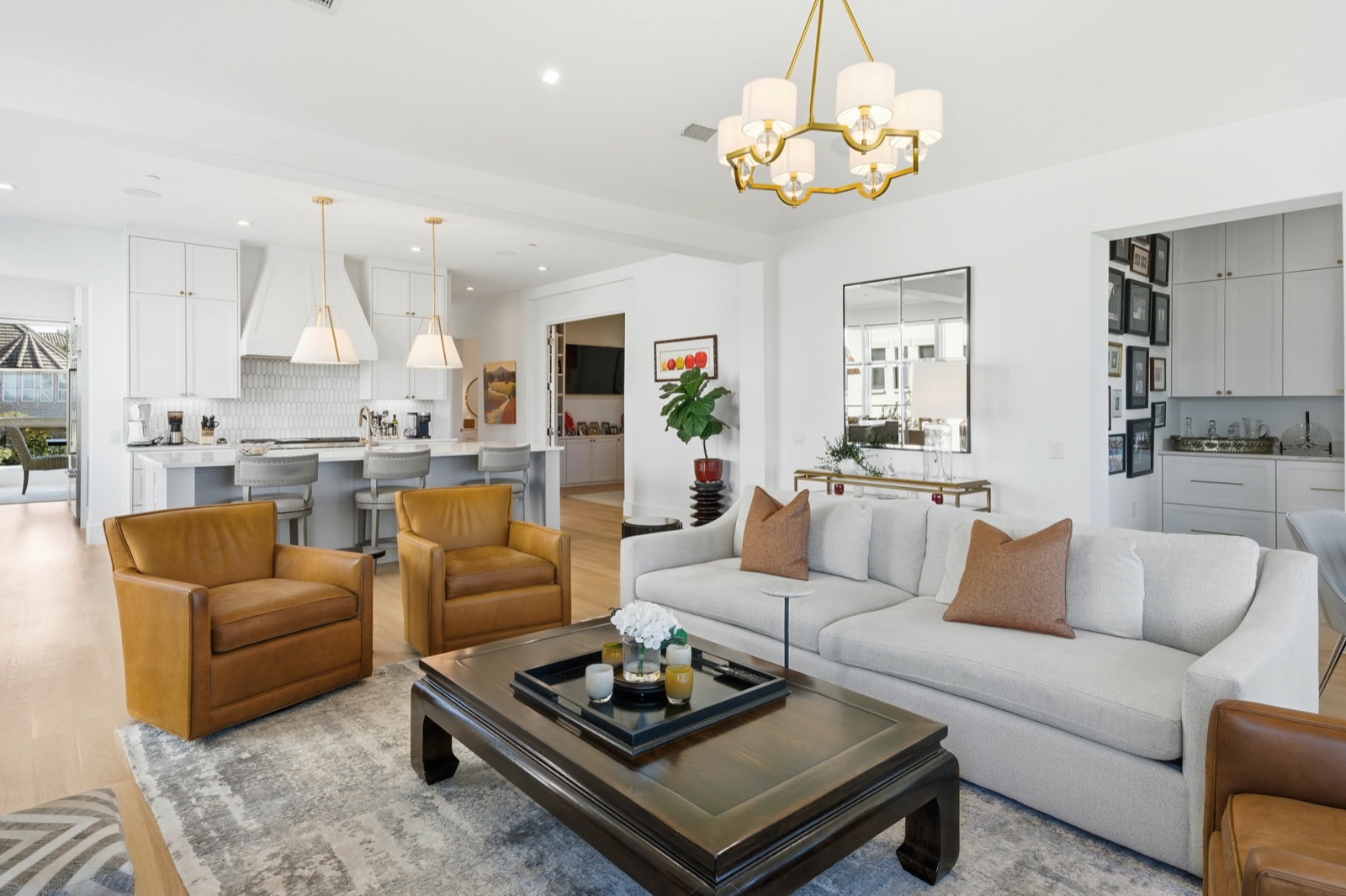 Living room with chandelier and view through to kitchen — F2 Visuals MLS photography