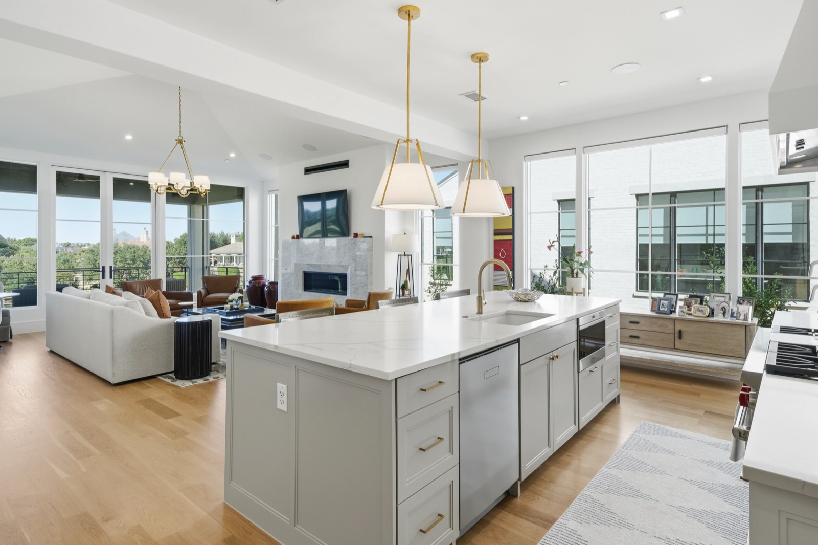 Modern open kitchen with island and lake view — F2 Visuals MLS photography
