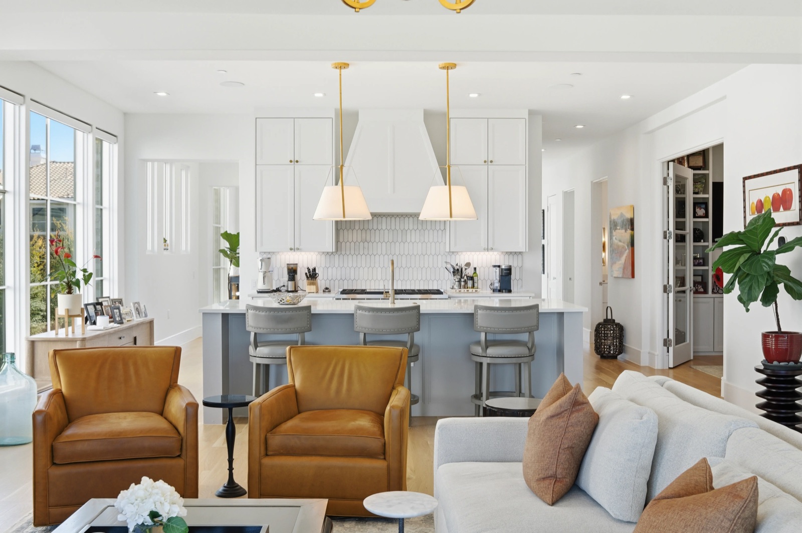 White kitchen with leather chairs and breakfast bar — F2 Visuals MLS photography
